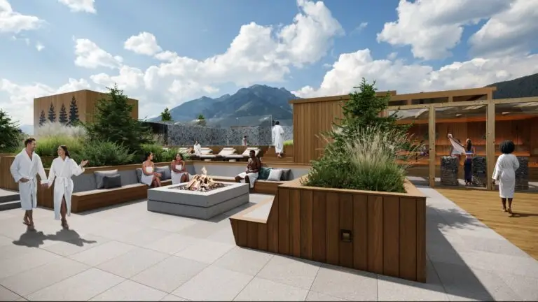 Luxury rooftop spa with people relaxing by a fire pit and mountains