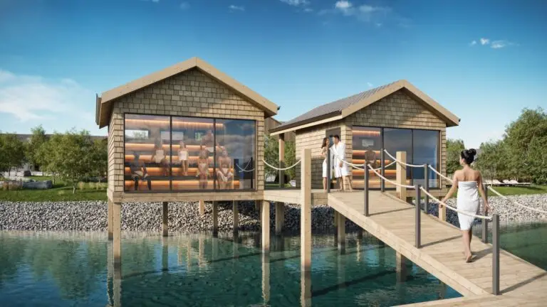 Luxury wellness resort investment: people in a waterfront sauna.