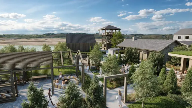 Luxury resort with outdoor seating, fire pits, and a pool overlooking a lake